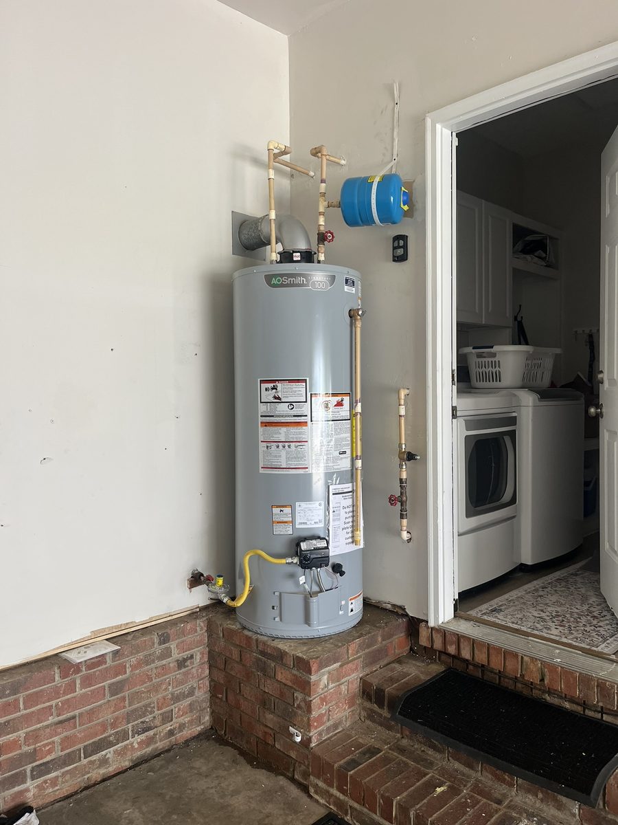New A.O. Smith gas water heater installed in a garage by Penguin Air & Plumbing